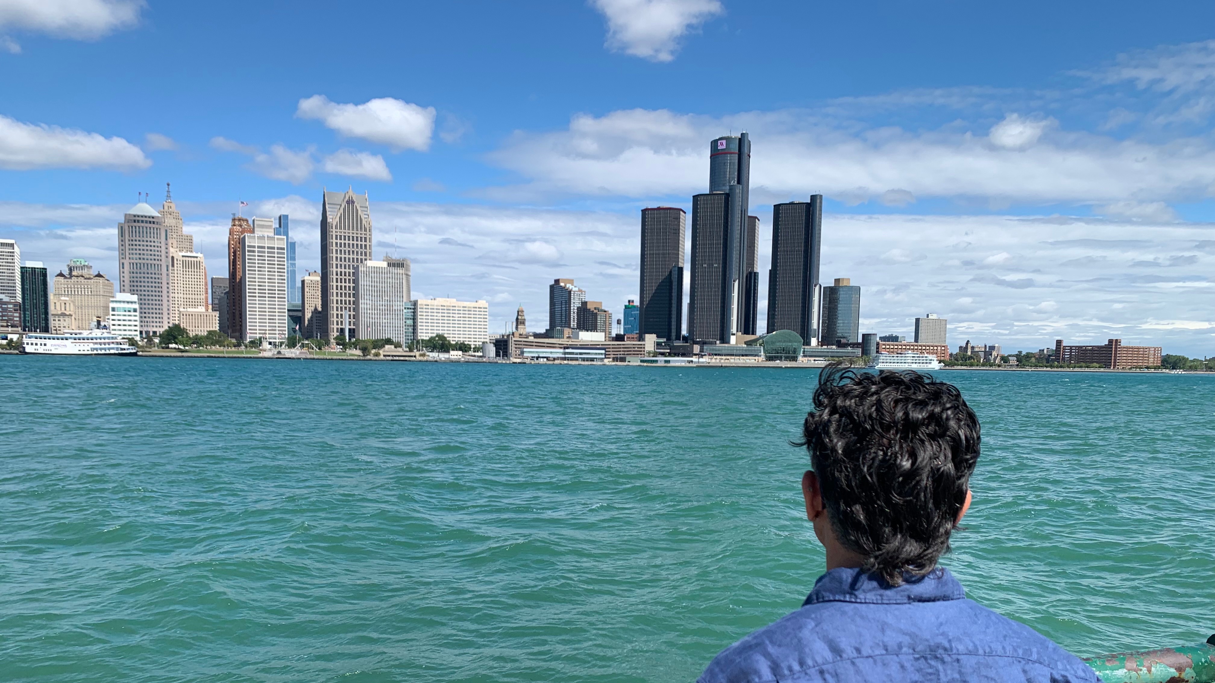 City Councillor Renaldo Agostino looks at the Detroit skyline across the Detroit River Monday, Aug. 24, 2026, in Windsor, Ontario (AP Photo/Mike Householder)