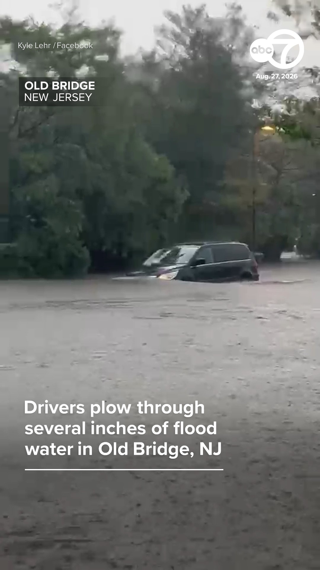Drivers plow through several inches of flood water in Old Bridge, NJ