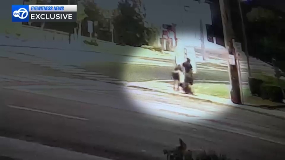 Group spotted opening Nassau manhole cover, entering sewer