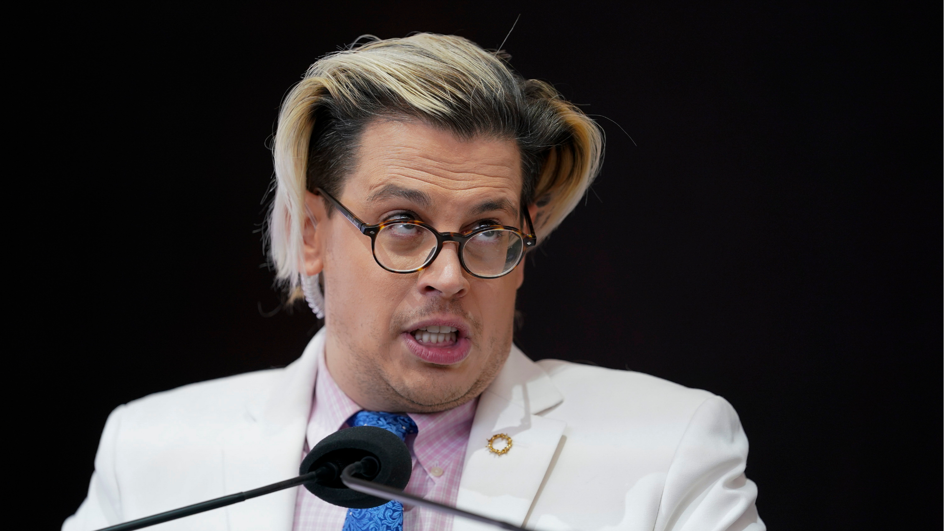 Activist Milo Yiannopoulos speaks during a rally outside of the Baltimore hotel where the United States Conference of Catholic Bishops are holding its Fall General Assembly meeting, Tuesday, Nov. 16, 2021, in Baltimore.
