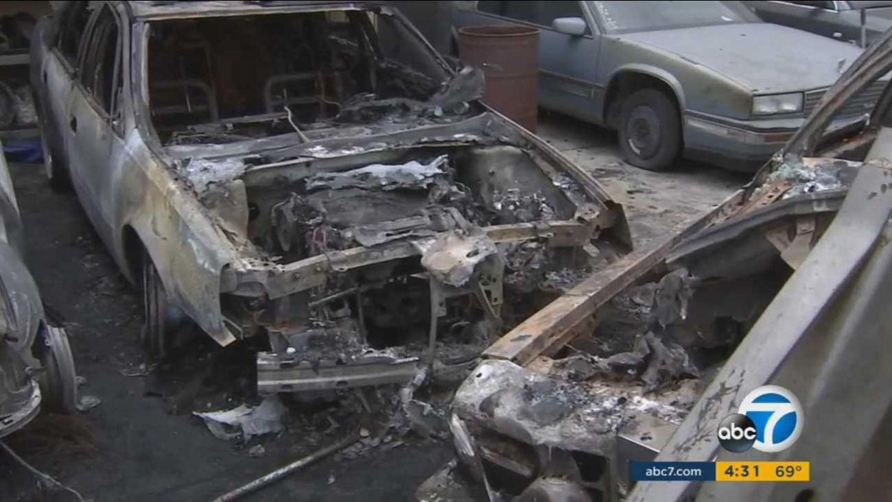Charred cars are seen at a Crenshaw District auto body repair shop in the 3500 block of South Crenshaw Boulevard on Tuesday, May 9, 2017.