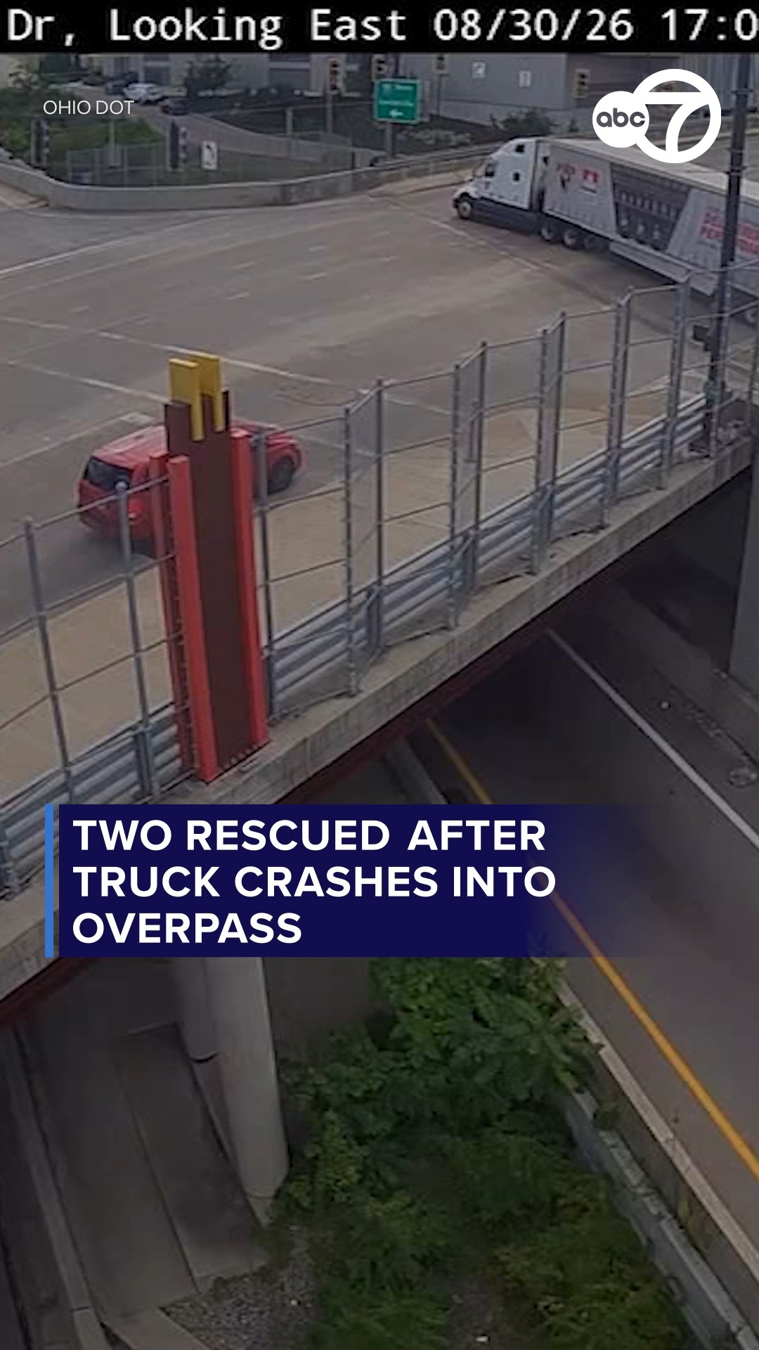 2 rescued after truck crashes into overpass
