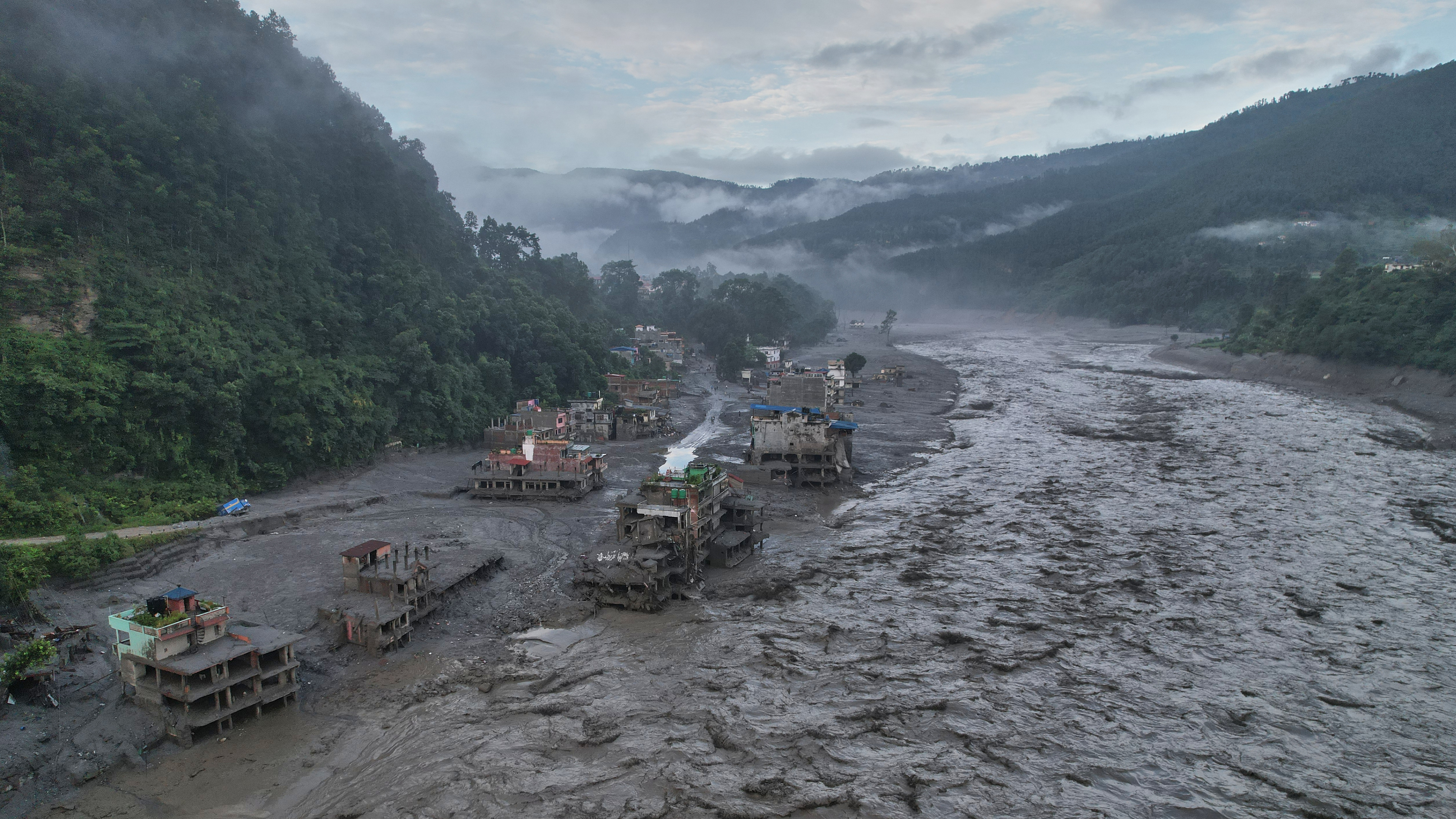A drone view of the aftermath of flash flooding along the Trishuli river amidst fresh water surge warning in the Trishuli Bazaar area of Nuwakot district, Nepal, Sunday, Aug. 30, 2026.