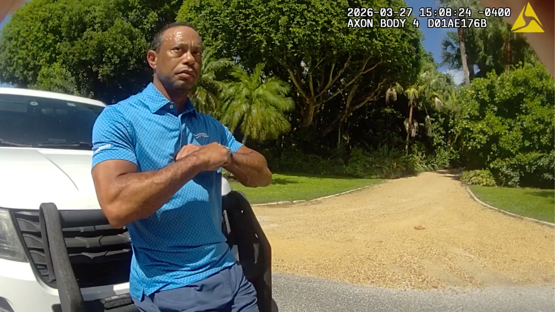 FILE - In this image from police body camera video released by the Martin County, Fla., Sheriff's Office, golfer Tiger Woods performs a field sobriety test for sheriff's deputies following a car crash in Jupiter Island, Fla., March 27, 2026.