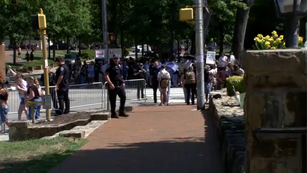 Protesters rally outside G20 Innovation Ministerial