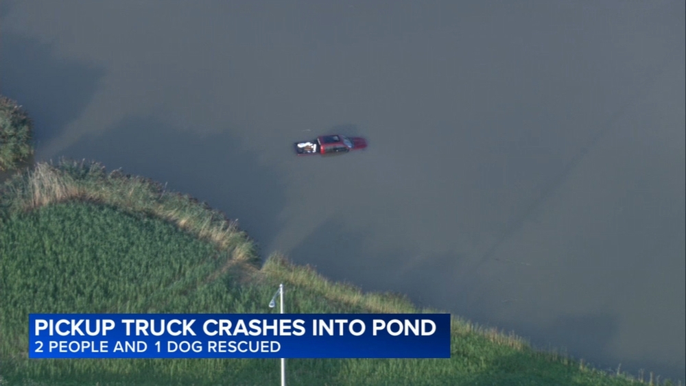 2 people, dog rescued after truck crashed into retention pond in Deerfield, police say
