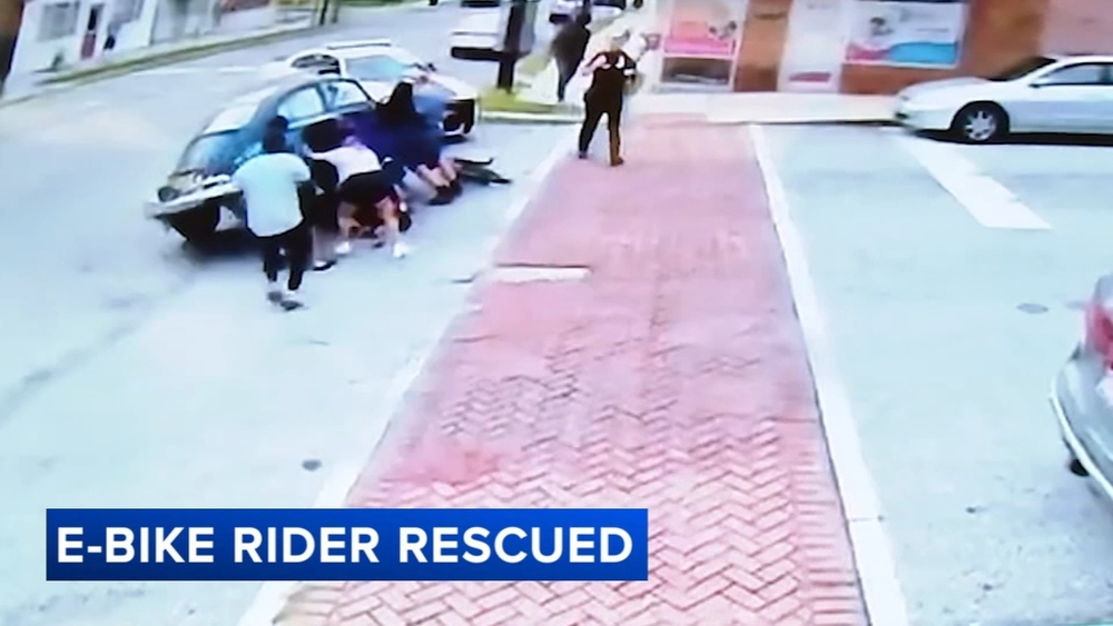 Community members lift car to rescue trapped e-bike rider in Prospect Park