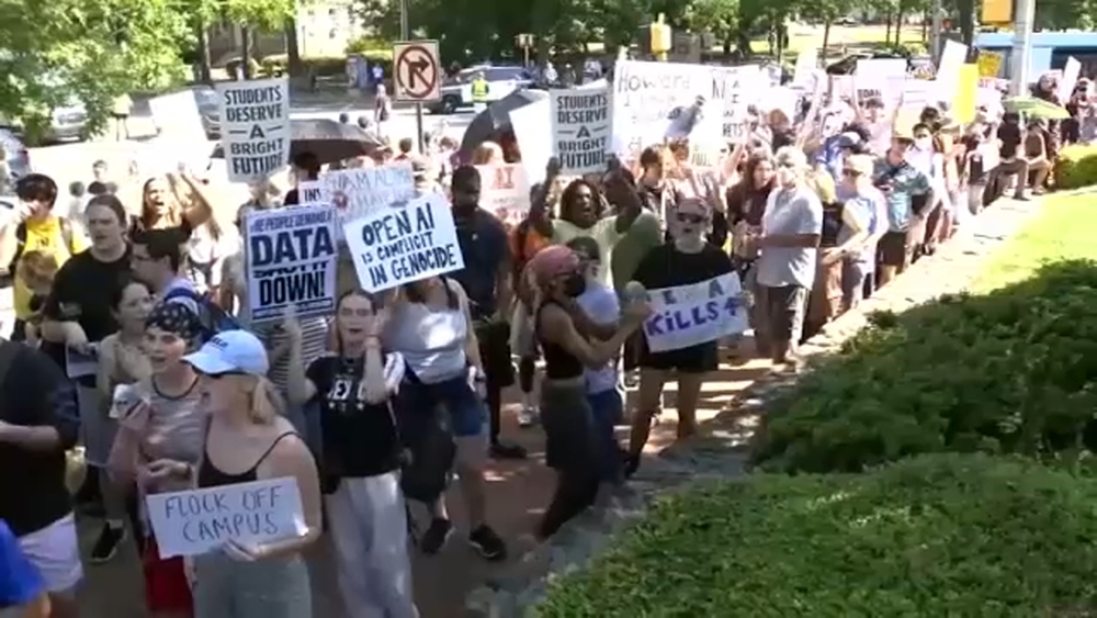Protesters gather outside Carolina Inn during G20 forum