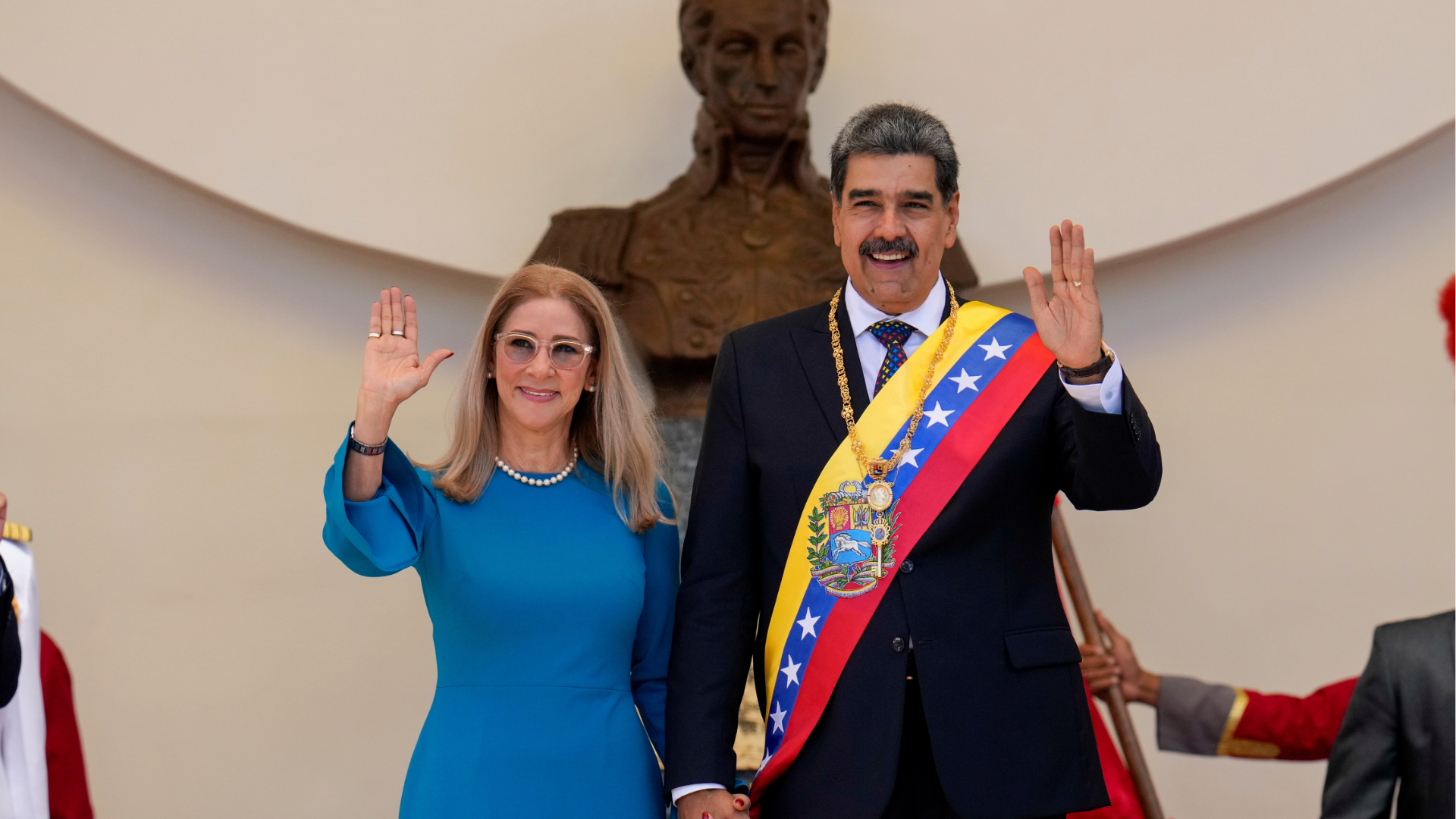 FILE - Venezuelan President Nicolas Maduro and his wife Cilia Flores wave after his swearing-in ceremony for a third term at the National Assembly in Caracas, Venezuela, on Jan. 10, 2025. 