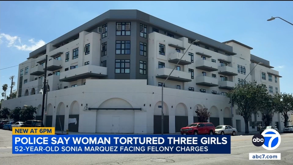Woman charged with abusing 3 girls, allegedly locking them in dog cage