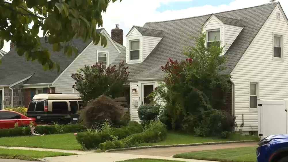 Queens neighborhood 'uneasy' after alleged squatter moves in