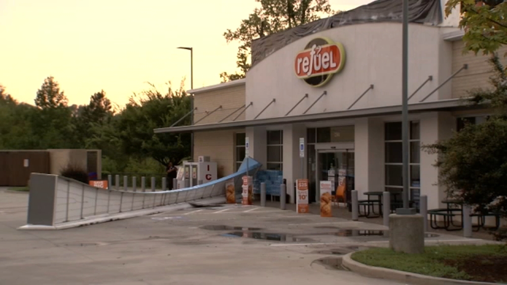 Powerful storms topple trees, tear roof of gas station
