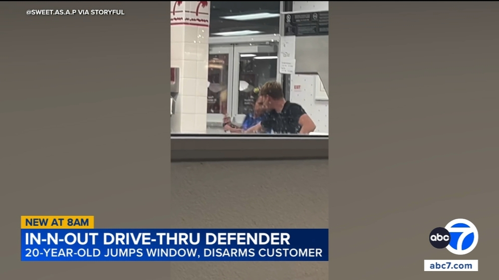 Man jumps through In-N-Out drive-thru window to stop armed woman