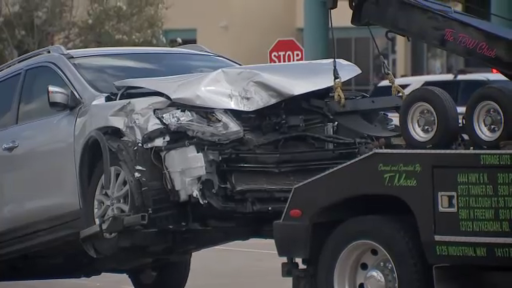 Driver evading deputies crashes into vehicle, flees on foot: Video