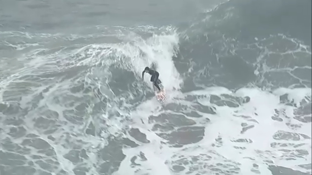 Crowds gather for big waves at The Wedge in Newport Beach