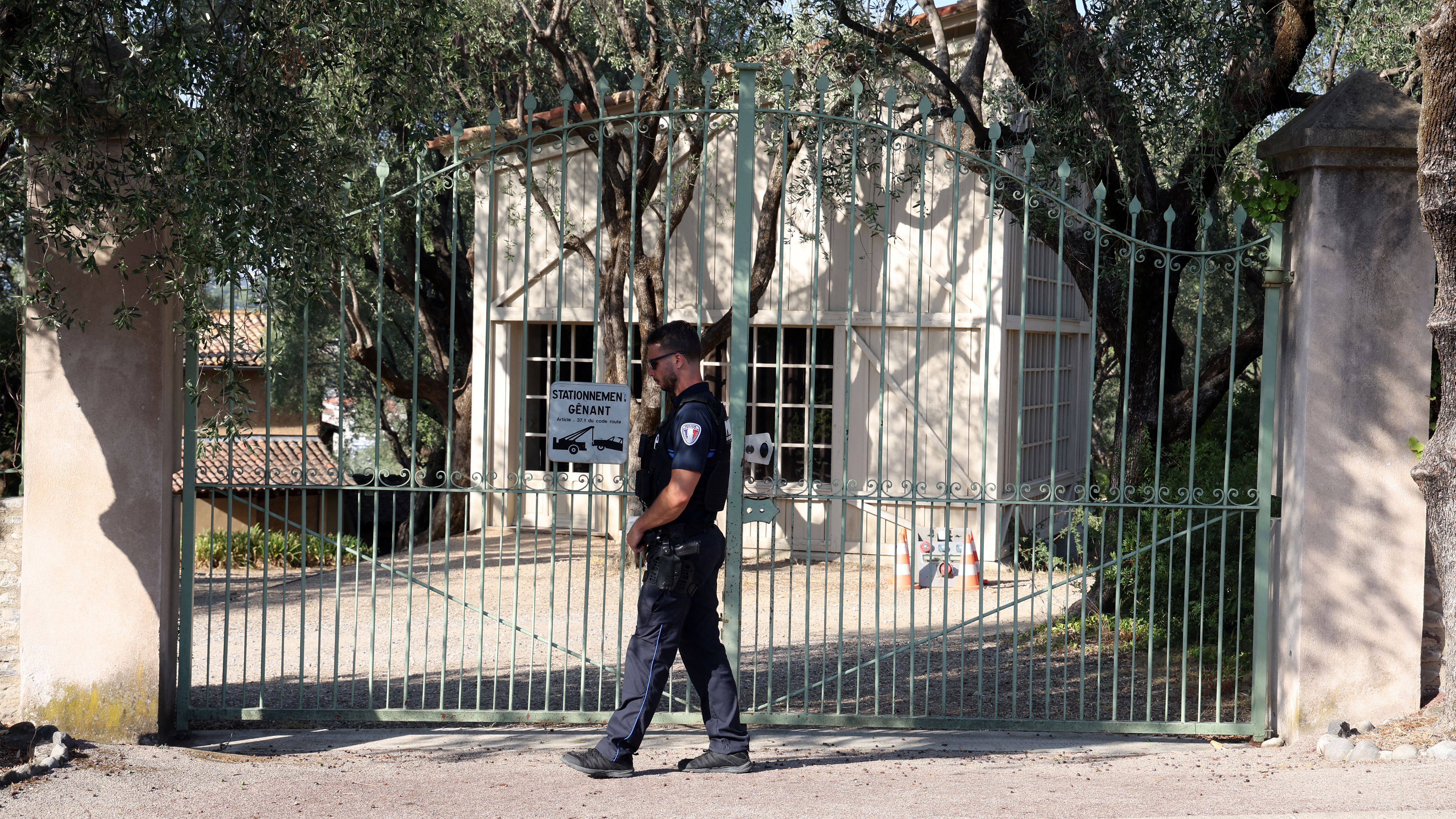 A police officer patrols in front of the entrance of the Musee Renoir after four paintings, valued at nine million euros, were stolen from the museum in an early-morning break-in, with two suspects still at large, in Cagnes-sur-Mer on September 8, 2026.