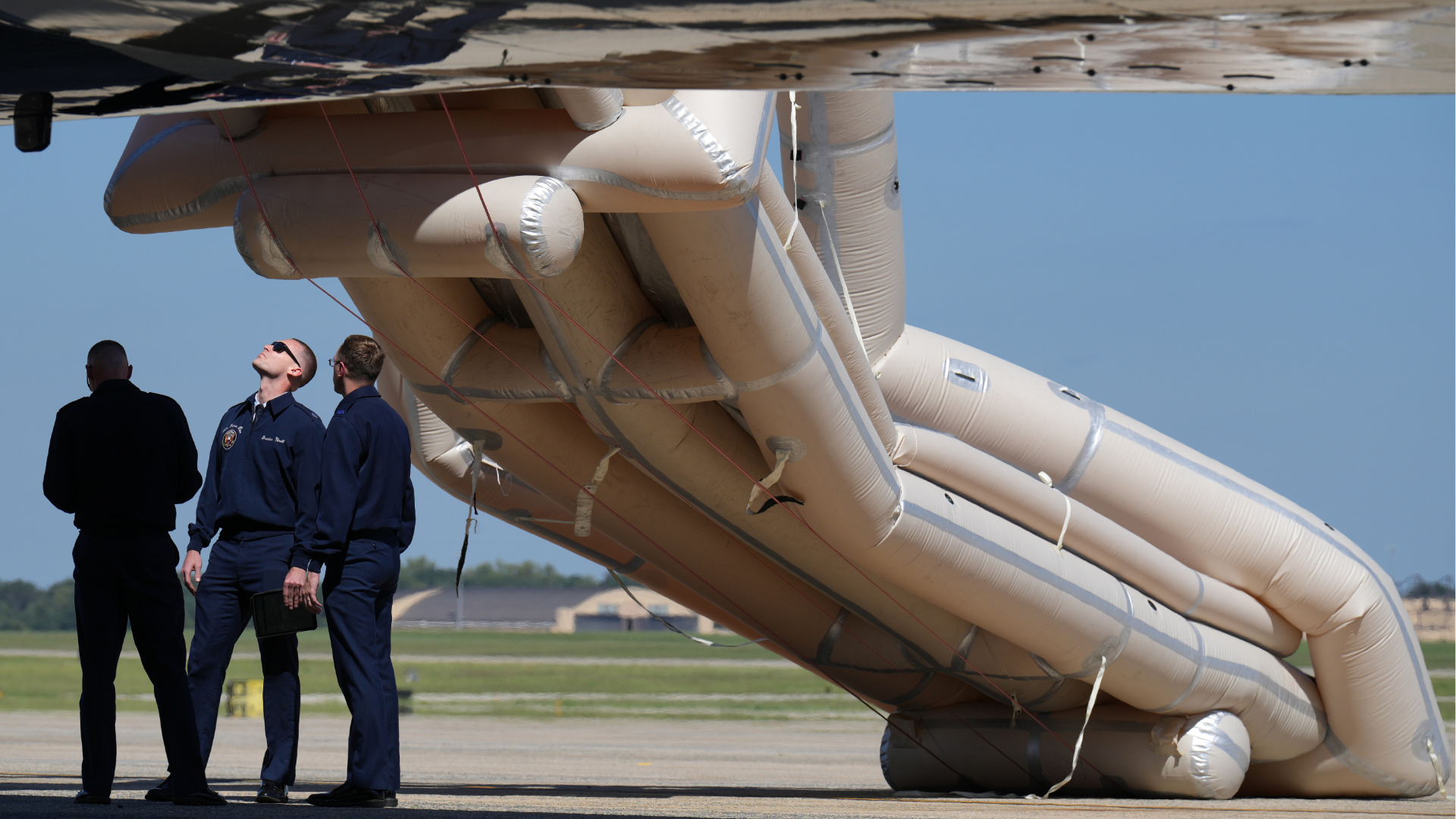 U.S. Air Force personnel look after an emergency inflatable slide deployed on Air Force One before before President Donald Trump arrived to board at Joint Base Andrews, Md., Wednesday, Sept. 9, 2026. 