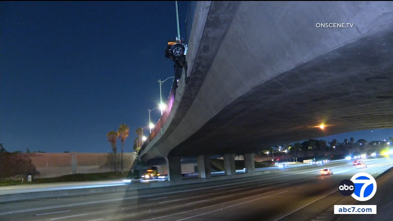 Corvette hangs from 5 Fwy overpass after Anaheim crash