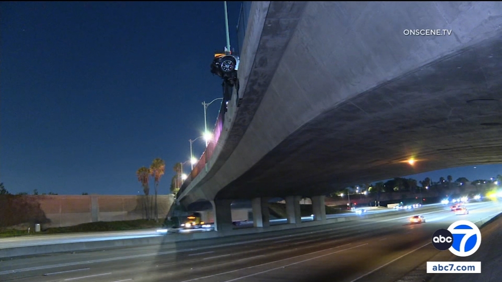 Corvette hangs from 5 Fwy overpass after Anaheim crash