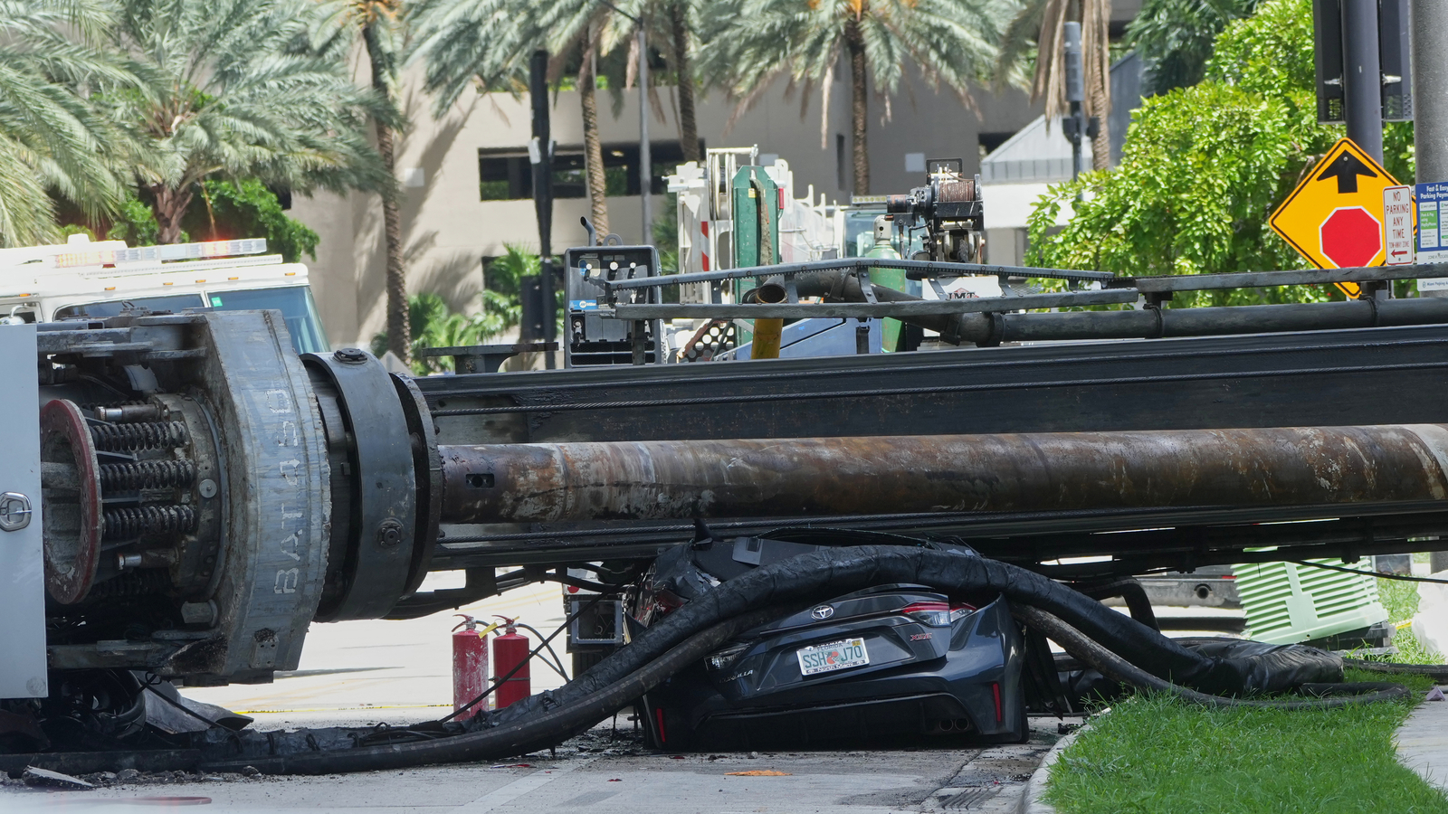 Officials say 4 people were hospitalized after a crane collapsed at a Miami construction site Officials say 4 people were hospitalized after a crane collapsed at a Miami construction site