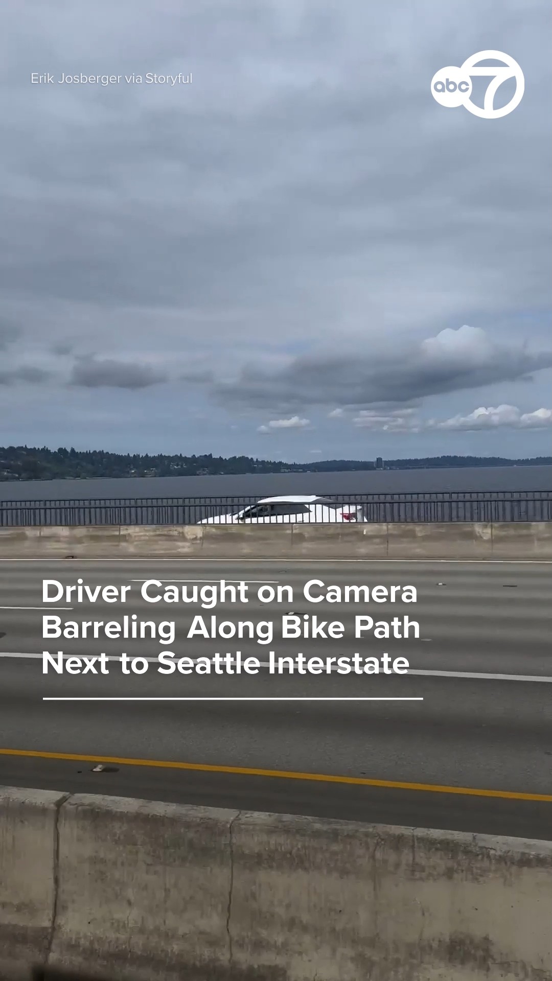 Driver caught on camera barreling along bike path next to interstate