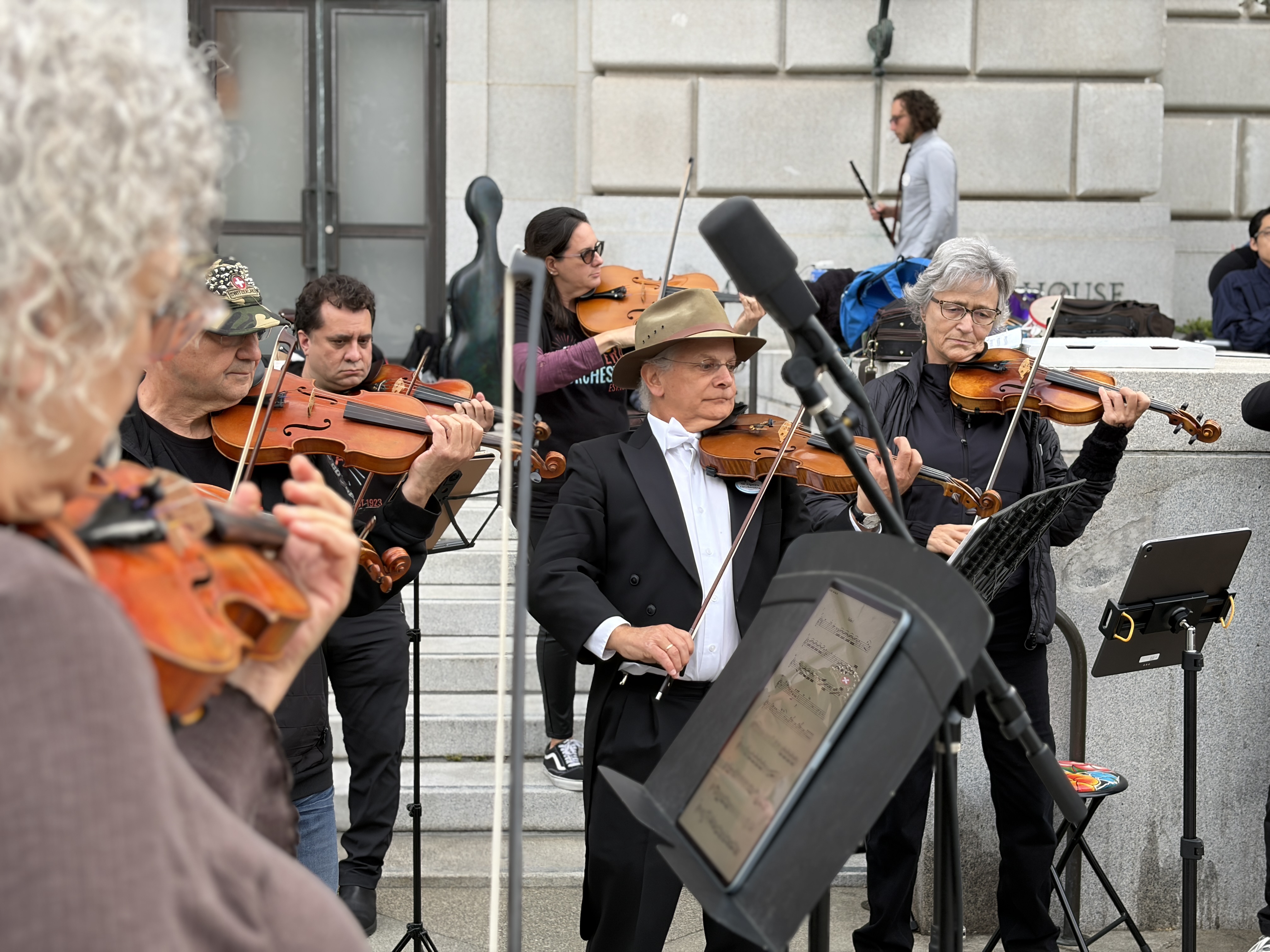 SF Opera Orchestra musicians perform outside during strike