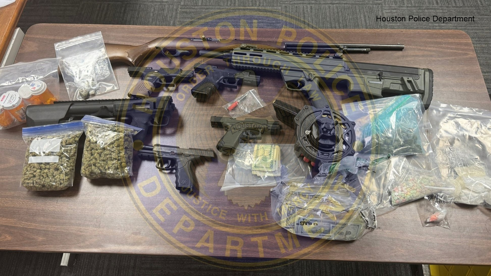 Guns, pills and cash: Illegal narcotics discovered during search warrant in northeast Houston, HPD says
      