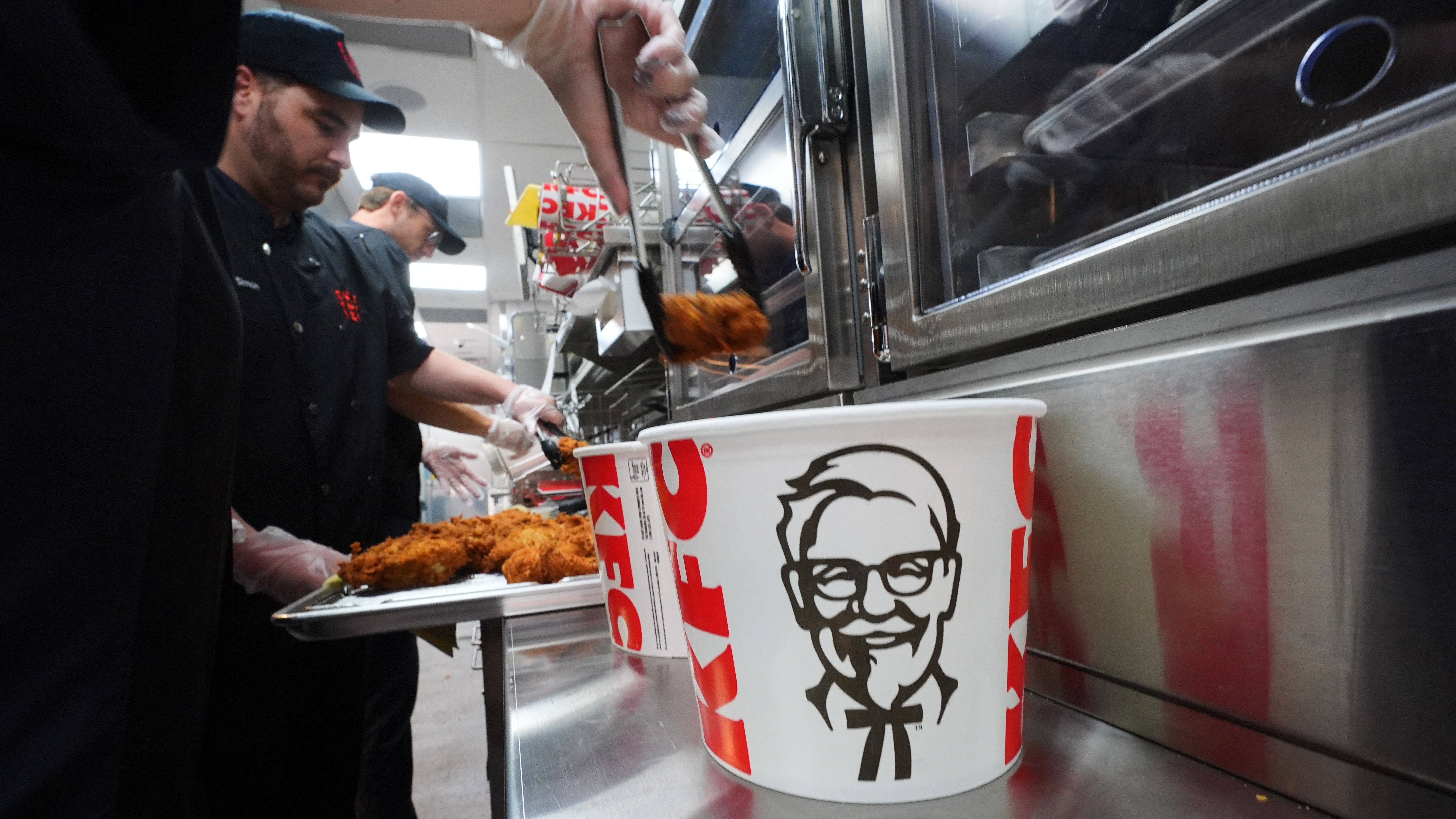 Fried chicken is placed into a bucket at a new KFC restaurant in McKinney, Texas, Tuesday, Sept. 22, 2026. (AP Photo/LM Otero)