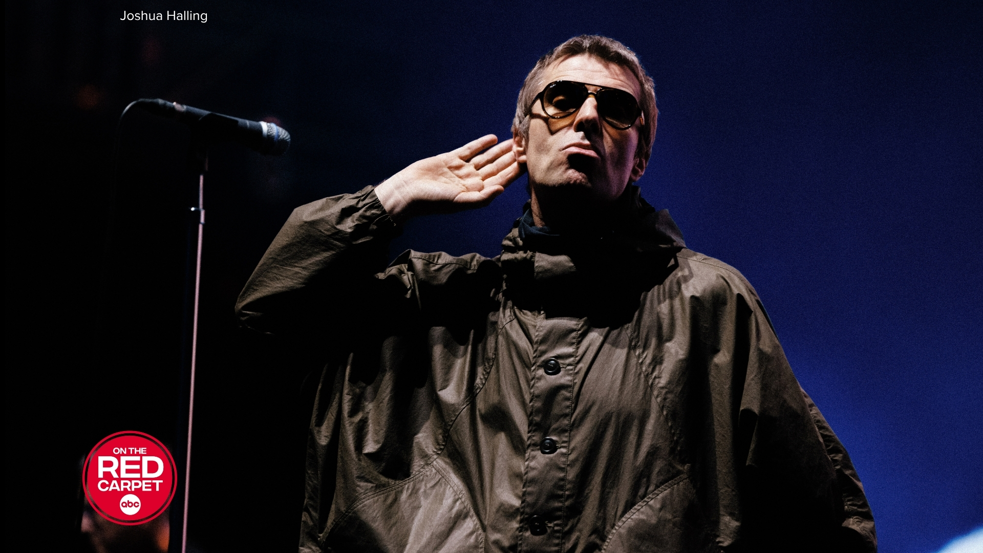 Liam Gallagher from Oasis performing on stage.