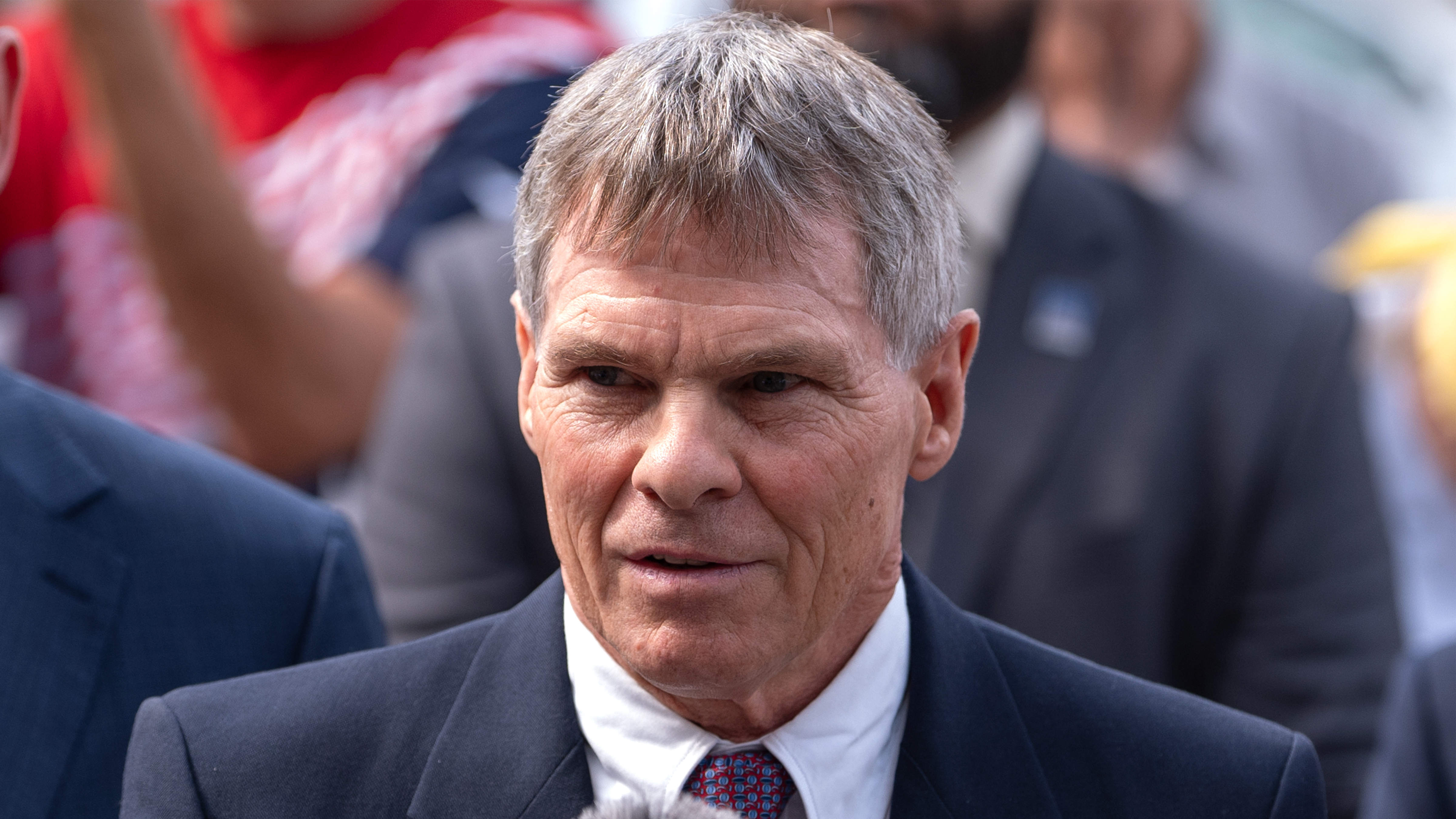 Former Olympic canoeist David Hearn, center, speaks to reporters outside the District of Columbia Courthouse Friday, Sept. 4, 2026.