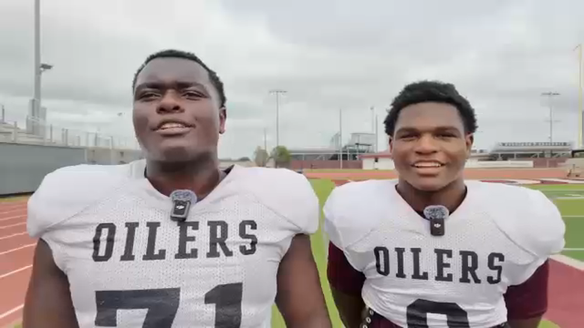 Pearland HS Football players RJ and Royce Swan celebrating a touchdown on the field