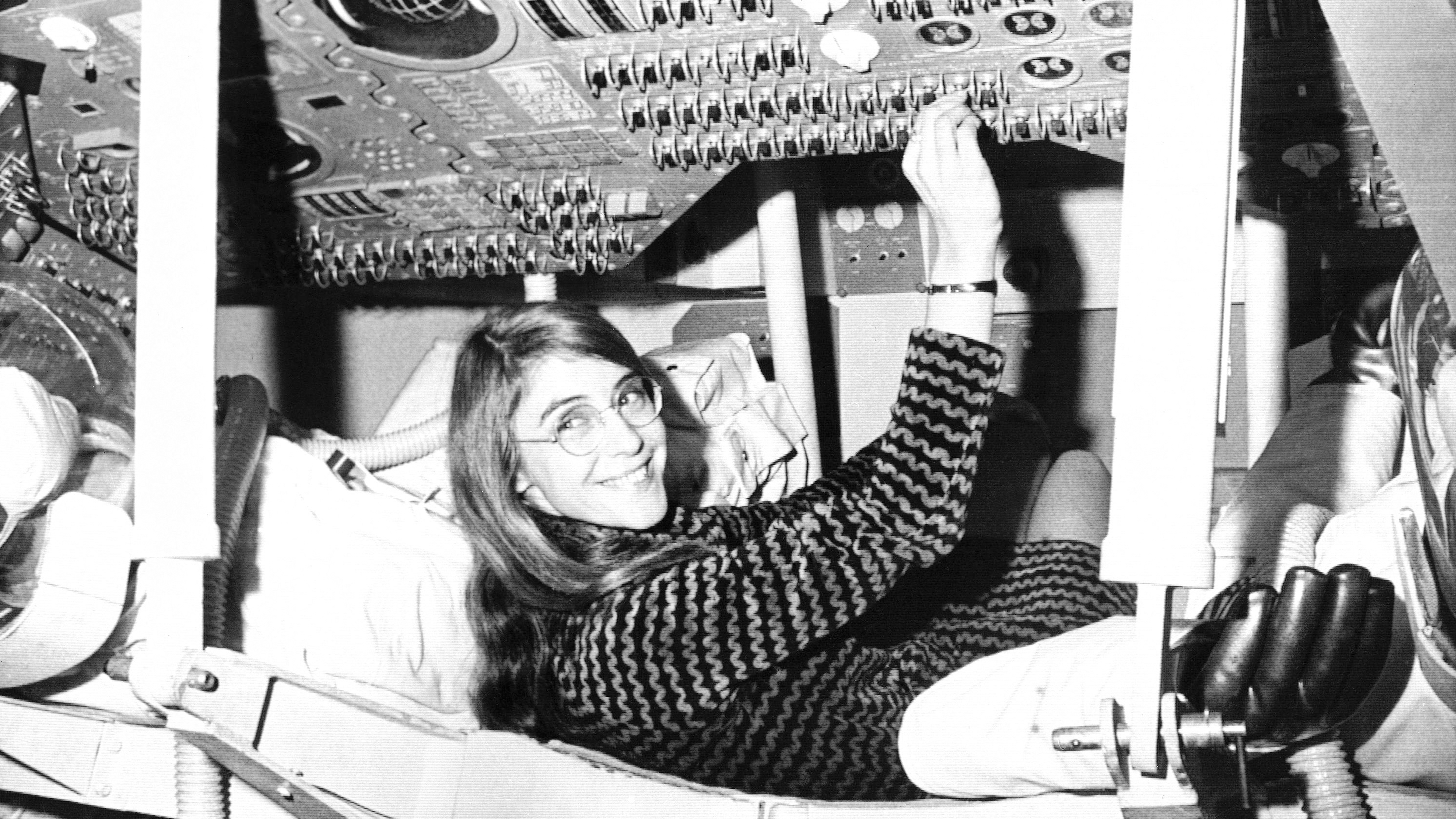 Margaret Hamilton, mathematic and computer programmer at the MIT Instrumentation Laboratory, sits in mock up of Apollo command module on display at the Cambridge school, Nov. 25, 1969.