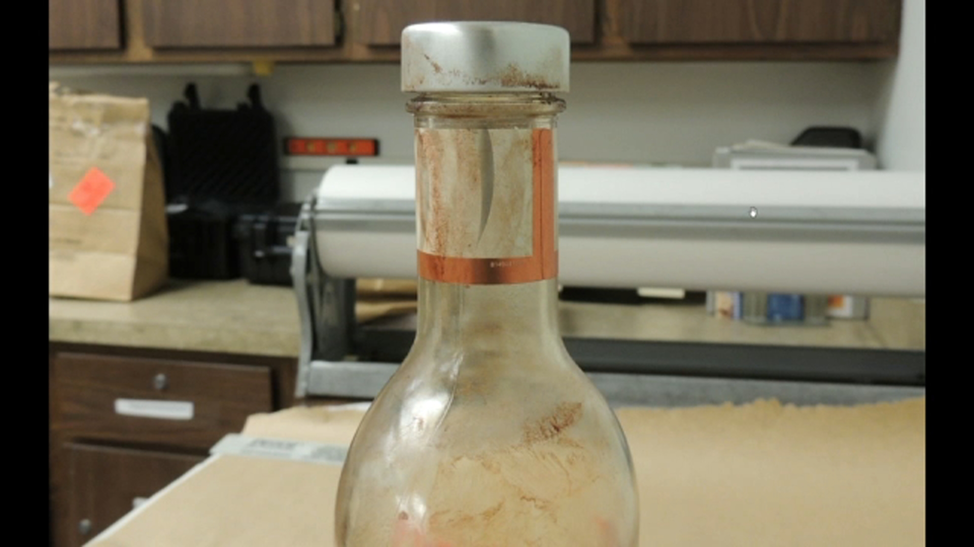The state shows jurors photos of a red Bacardi Peach bottle (Tuesday, Oct. 13, 2026)