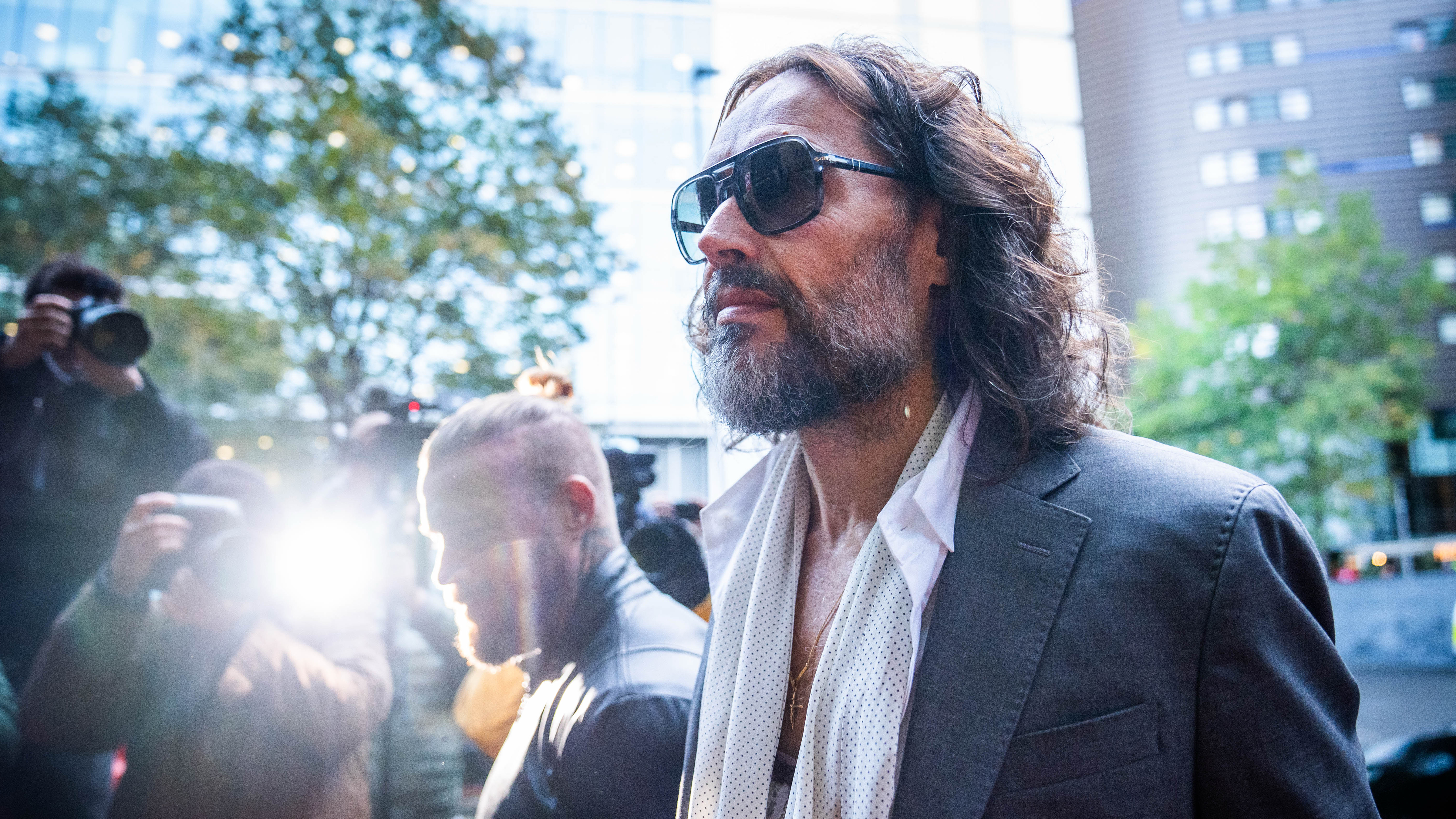 Russell Brand arrives at Southwark Crown Court, in London, Thursday Oct. 22, 2026, where he faces three charges of rape, indecent assault, and three counts of sexual assault, relating to six women. 