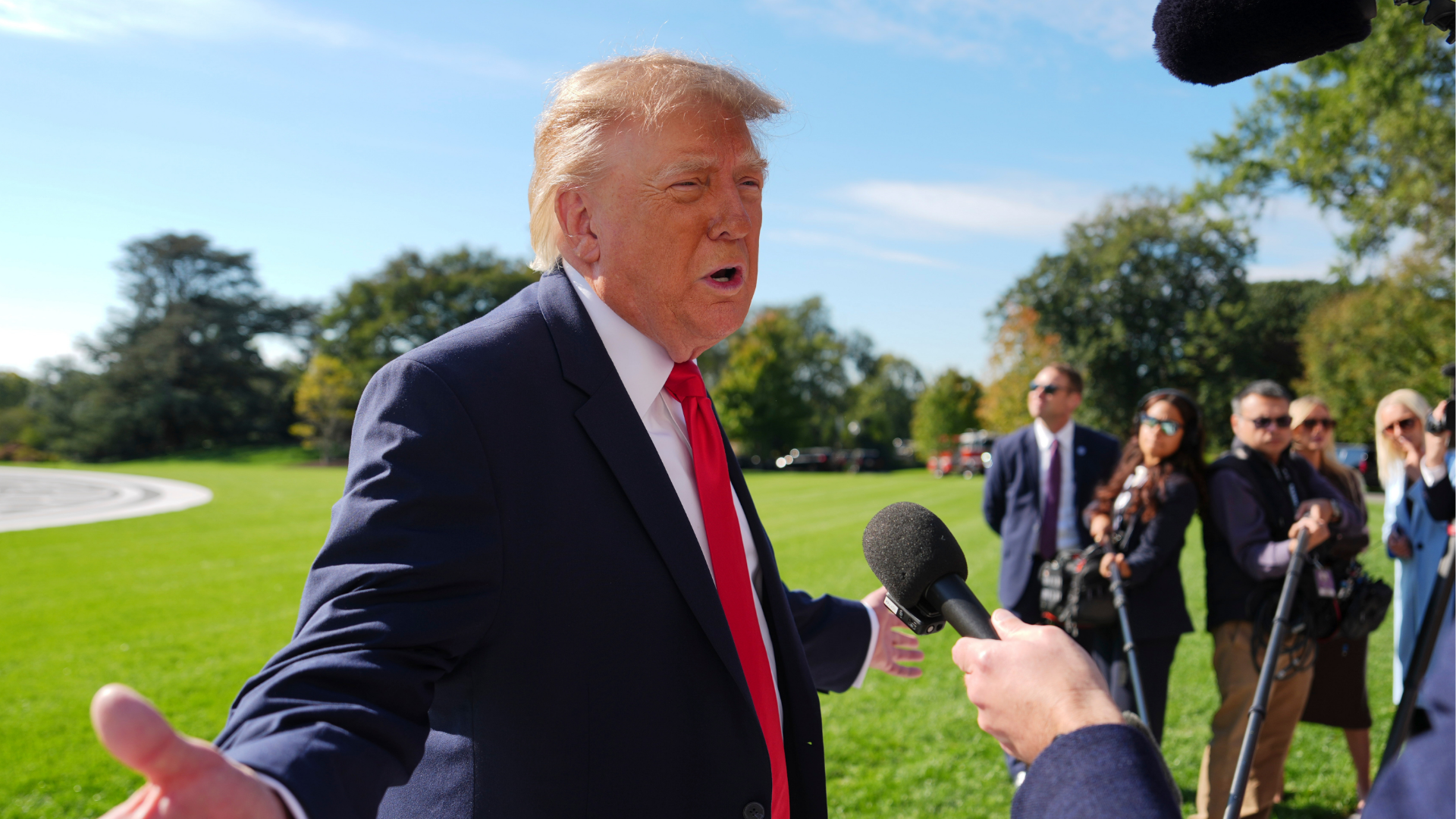 President Donald Trump speaks with reporters before boarding Marine One on the South Lawn of the White House, Friday, Oct. 23, 2026, in Washington.