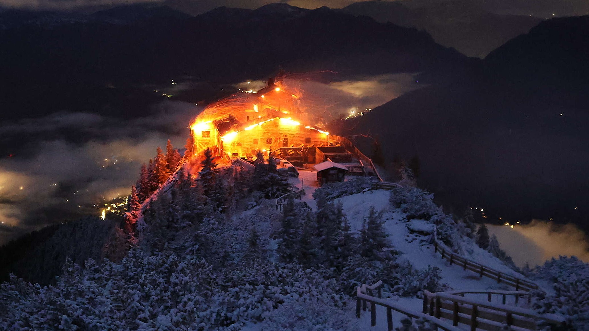 This image distributed by the 'Bergerlebnis Berchtesgaden' shows a building known as the Eagle's Nest built for Adolf Hitler in the Bavarian Alps on fire on Oct. 24, 2026.