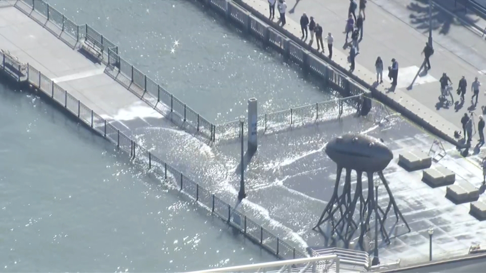 High tides spill water onto the Embarcadero in SF
