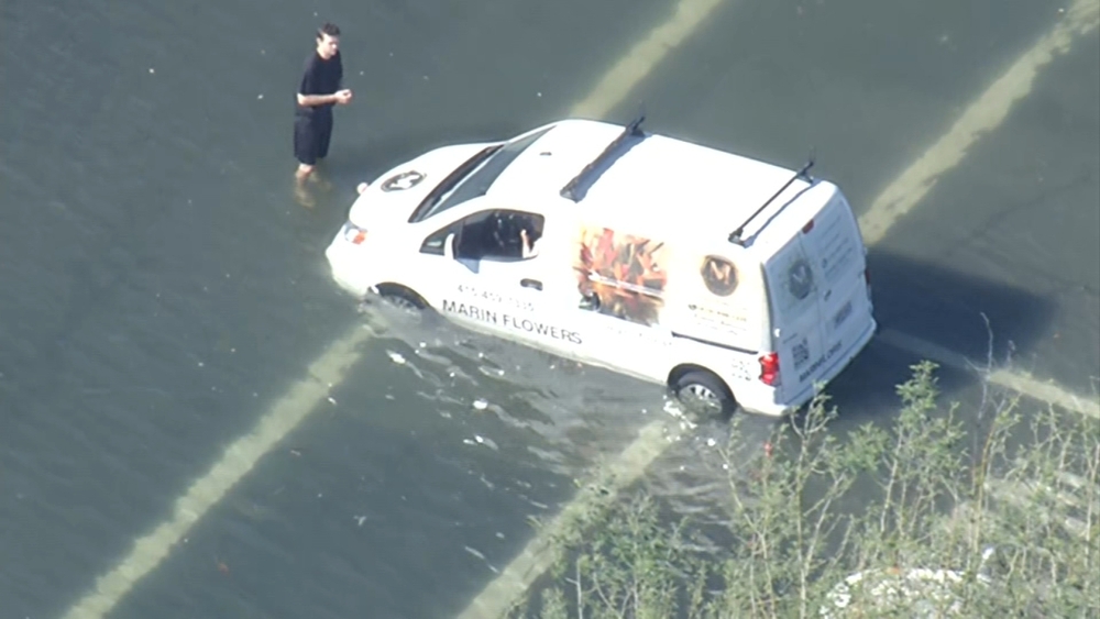 Flower van stuck in Bay Area high tide floodwaters