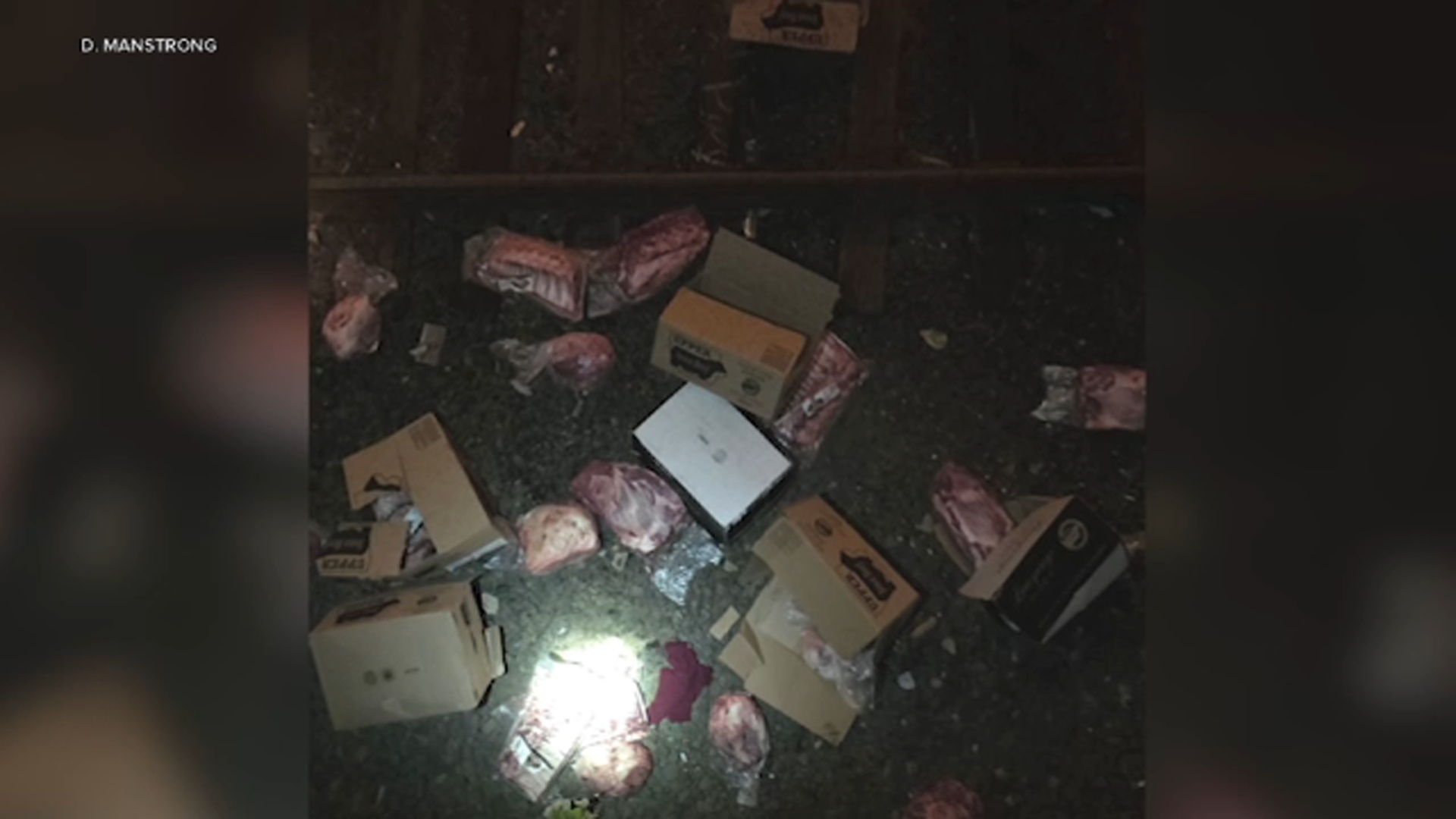 Cases of meat were found over the side of I-95, landing on the train tracks below. They were the same Upper Iowa Beef boxes that were taken from the tractor-trailer.