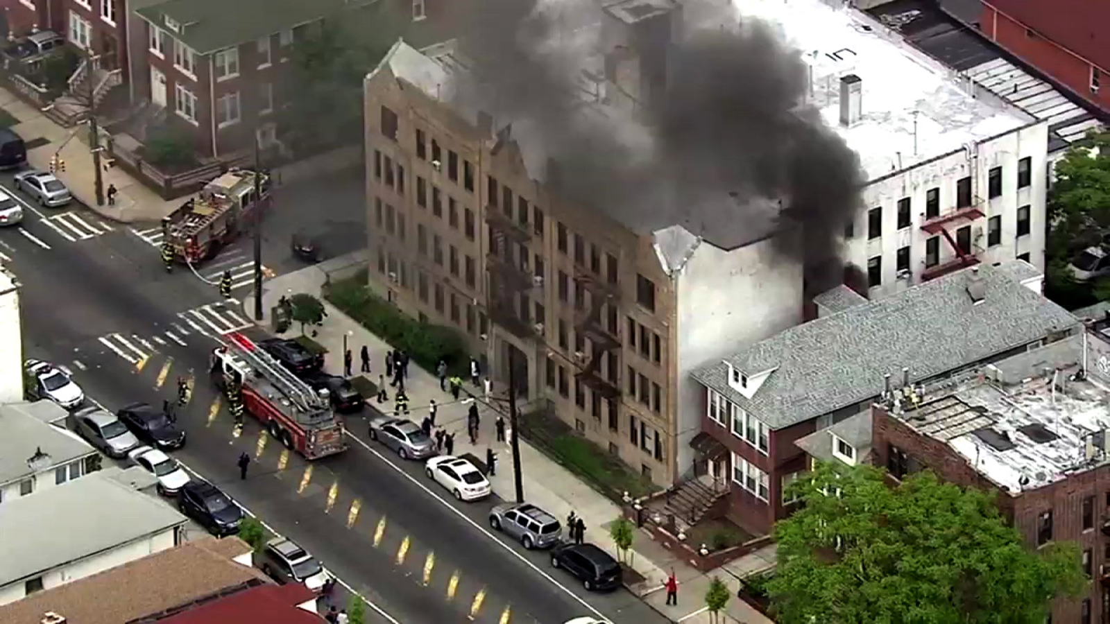 Residents flee down fire escapes as fire tears through Brooklyn