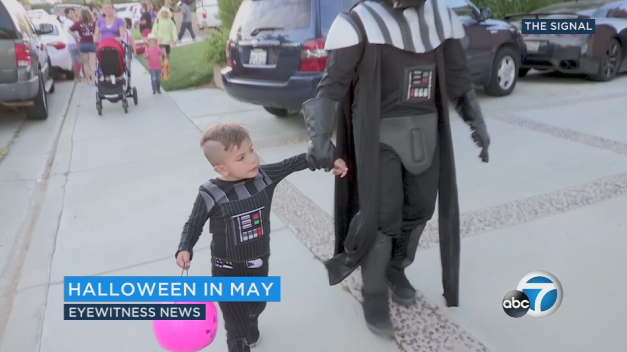 A neighborhood celebrates Halloween in May for boy battling rare disease 