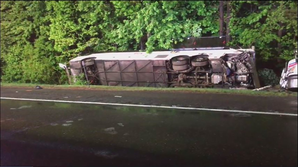 Several injured after bus flips, tractor-trailer jackknifes