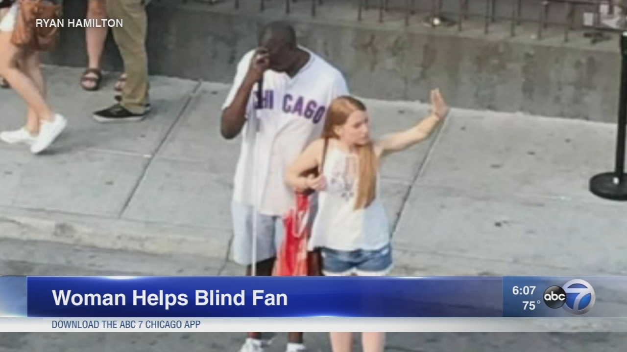 Woman helps blind Cubs fan hail cab