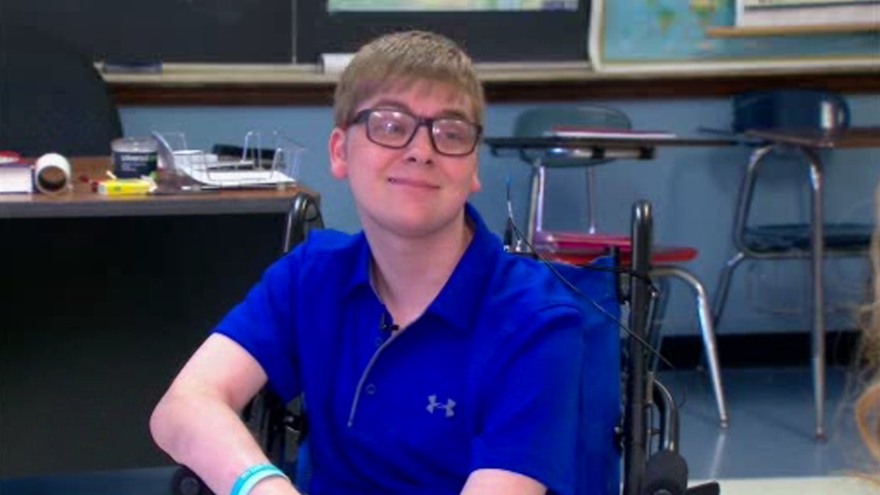 Senior walks across stage despite debilitating condition