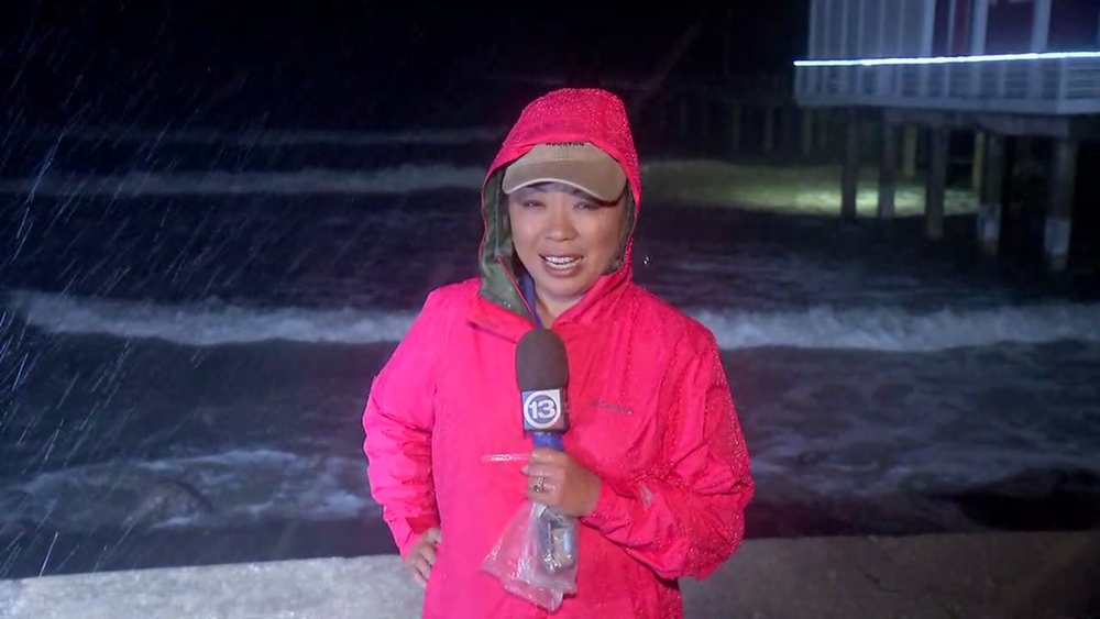 Miya Shay pelted by rain on Galveston Island