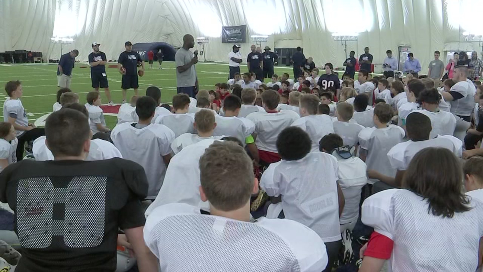 Players teach fundamentals during Texans youth football camp ABC13