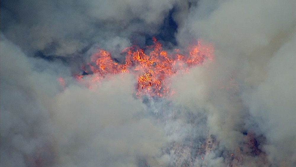 Highland brush fire closes Hwy 330; structures threatened
