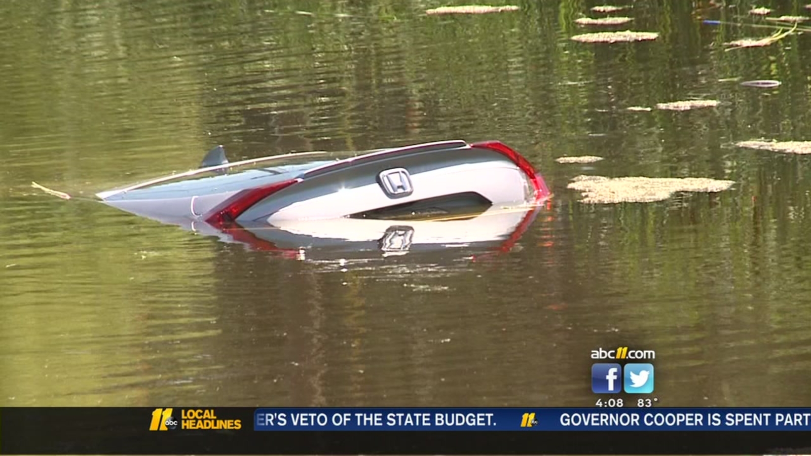 Driver, pregnant passenger rescued from partially submerged car in ...