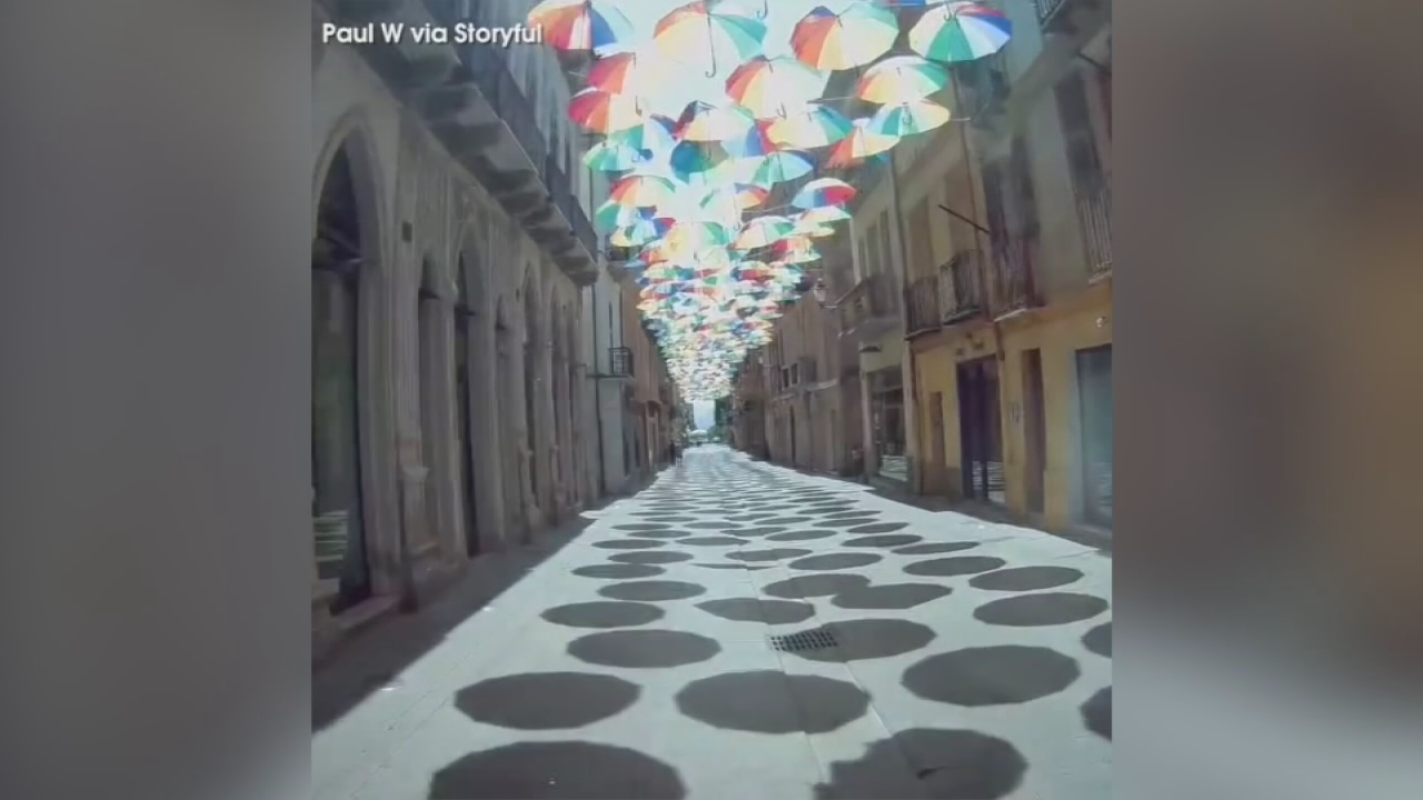 VIDEO: Vibrant umbrella display over streets of Sardinia