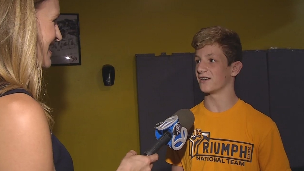 8th grader proves he can wrestle, help others